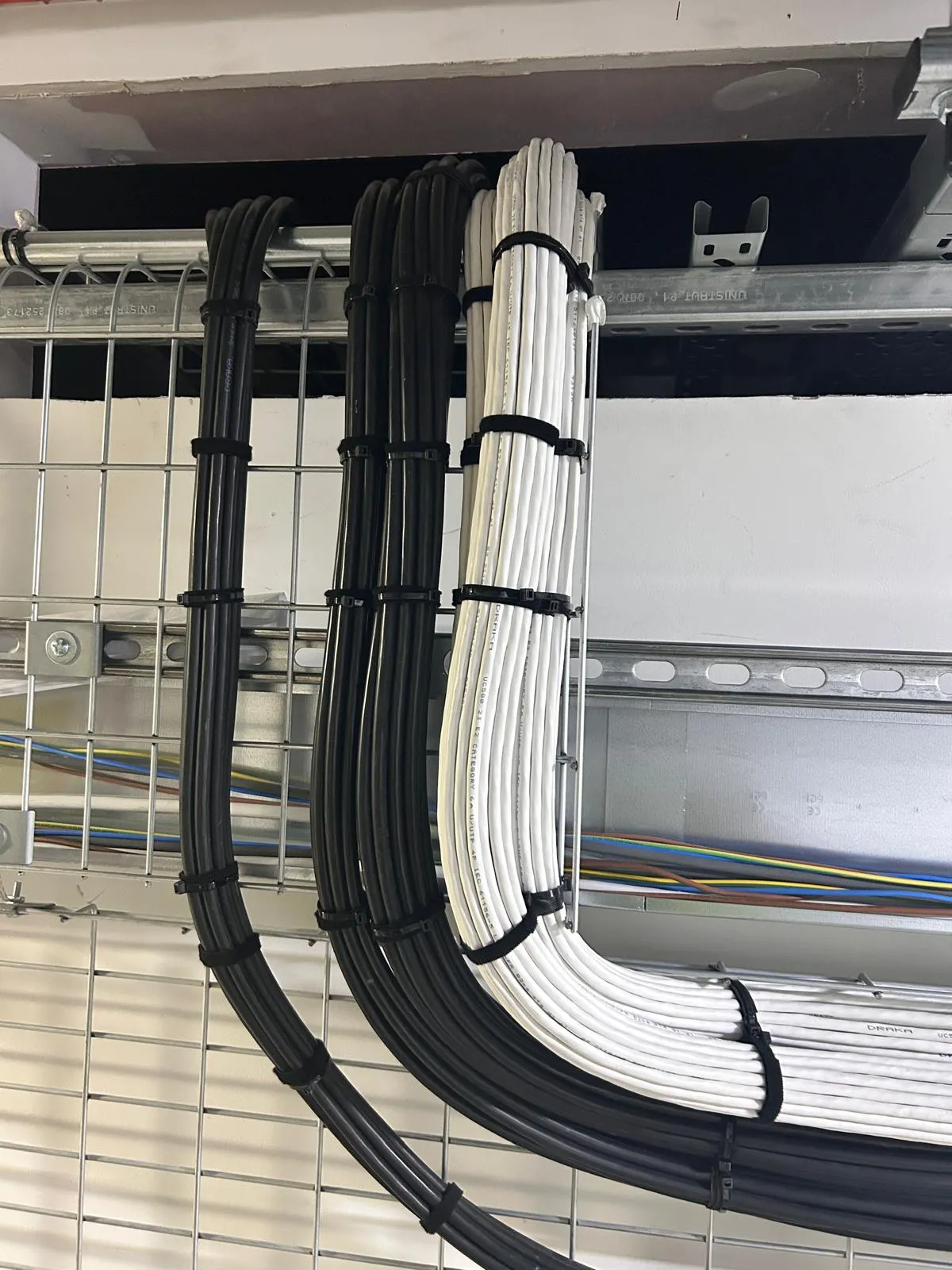 Category 6A cabling dressed in basket tray with precise 90-degree bends