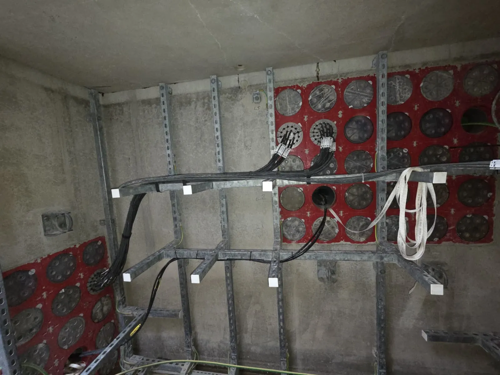 Industrial cable entry and containment in a utility vault installation
